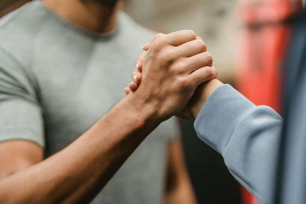 Firm handshake between two people